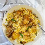 rice cooked with spices, chicken and potatoes