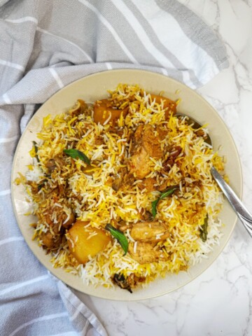 rice cooked with spices, chicken and potatoes