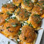 Shredded chicken seasoned with buffalo sauce and ranch. Served as sliders, perfect for the game night