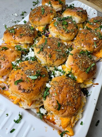 Shredded chicken seasoned with buffalo sauce and ranch. Served as sliders, perfect for the game night