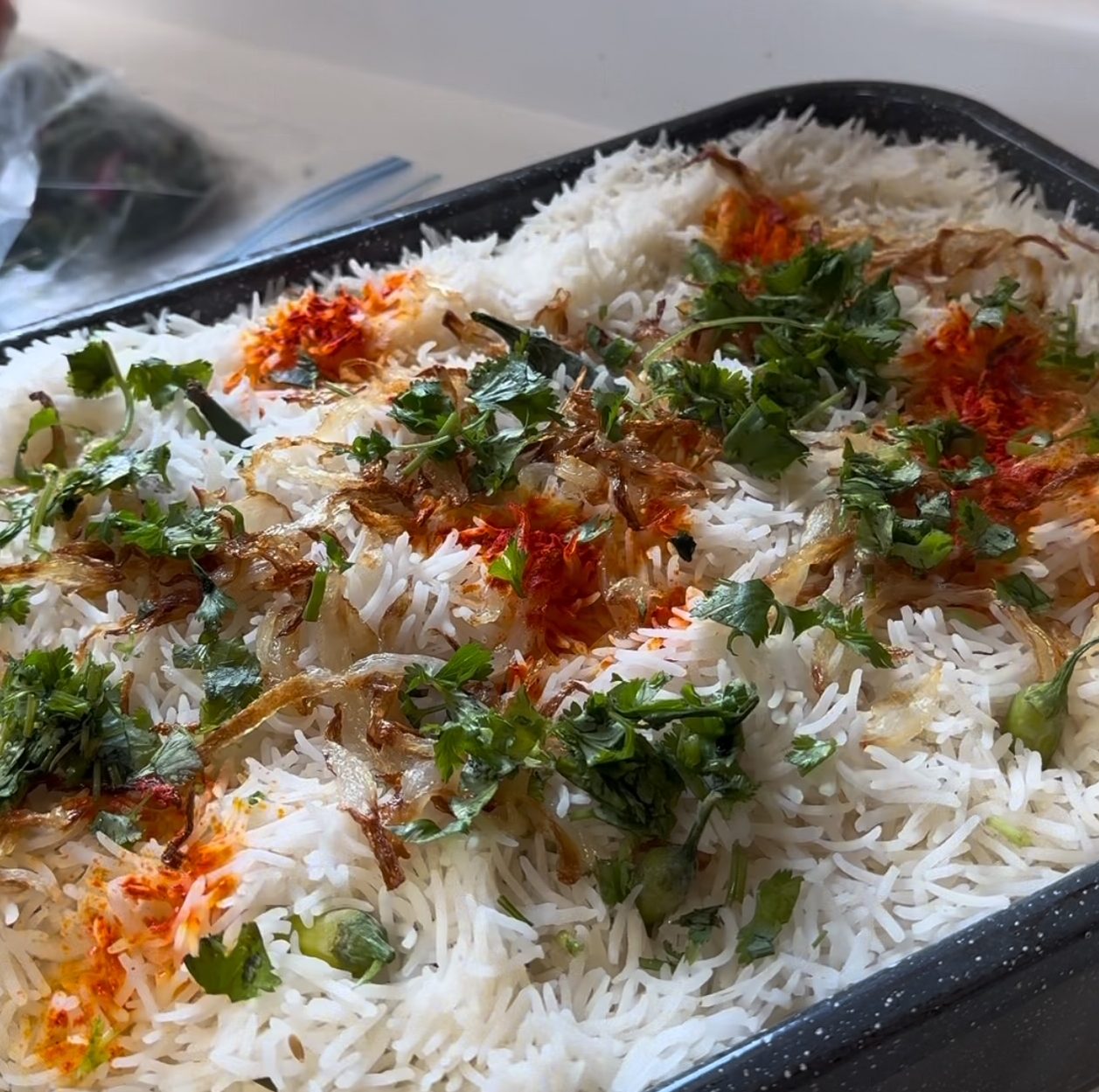 Make biryani, a rice and chicken dish for 30 people