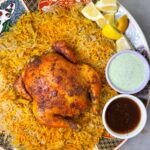Whole chicken is marinated and baked with sajji masala, then served with fragrant sajji rice