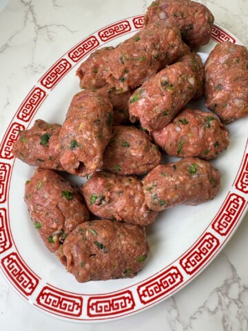 Gola Kabob is a ground beef recipe that is mixed with chopped veggies and spices and then fried