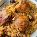 Chicken kabsa is the rice and meat dish with tomato base stock
