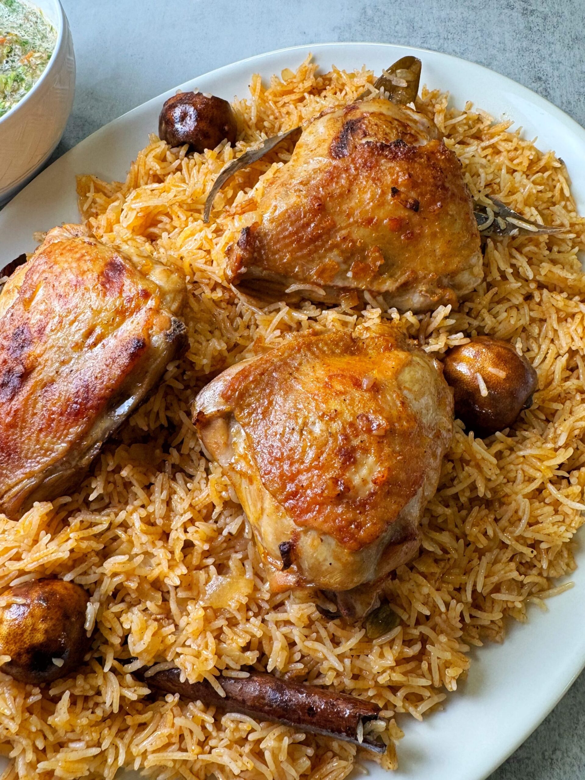 Chicken kabsa is the rice and meat dish with tomato base stock
