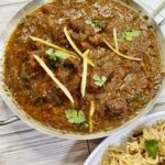 Beef cubes are fried with spices and then cooked with tomatoes until fork tender.