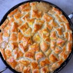 A freshly packed chicken and mushroom pie freshly out of the oven