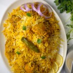 A rice and chicken recipe made with spices blend, tomatoes and rice named Pakistani biryani