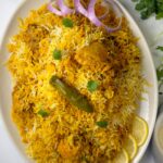 A rice and chicken recipe made with spices blend, tomatoes and rice named Pakistani biryani