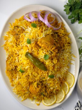 A rice and chicken recipe made with spices blend, tomatoes and rice named Pakistani biryani