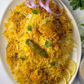A rice and chicken recipe made with spices blend, tomatoes and rice named Pakistani biryani
