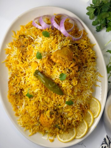 A rice and chicken recipe made with spices blend, tomatoes and rice named Pakistani biryani