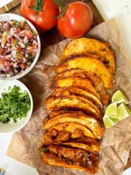 cheesy and crispy tacos are filled with luscious and creamy butter chicken