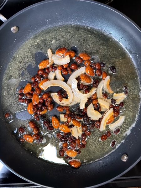 almods, raisins, and coconut is fried in ghee