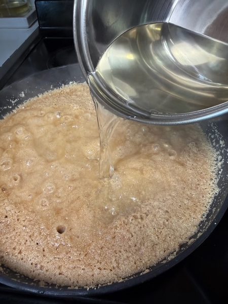 a picture showing the sugar syrup is added to sooji