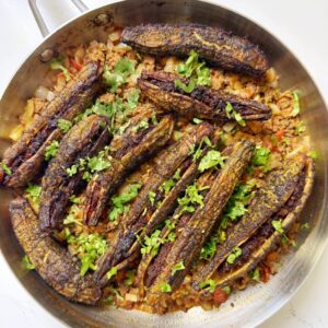 bitter gourds are stuffed with ground beef and then fried